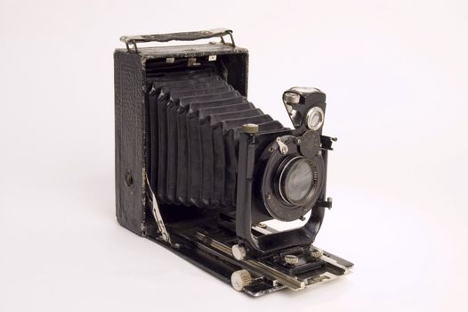 The old photographic chamber with a lens of furs on a white background.