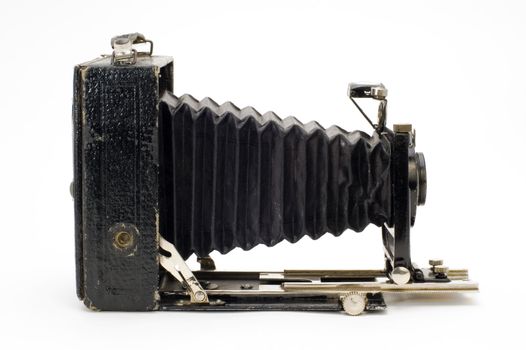 The old photographic chamber with a lens of furs on a white background.