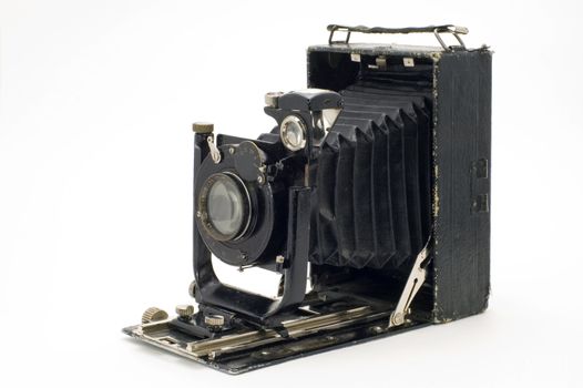 The old photographic chamber with a lens of furs on a white background.