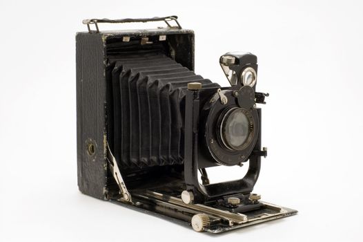 The old photographic chamber with a lens of furs on a white background.