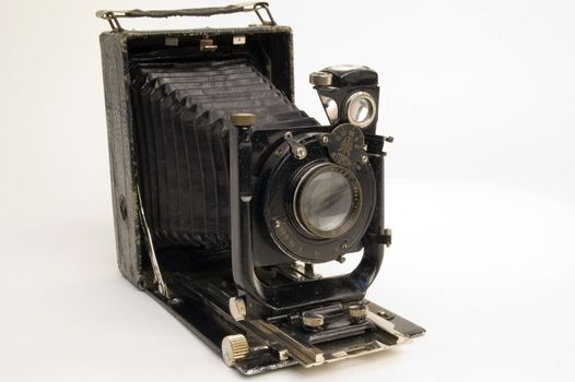 The old photographic chamber with a lens of furs on a white background.