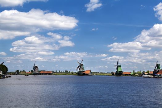 few different windmill on the horizon in Zaanse Schans