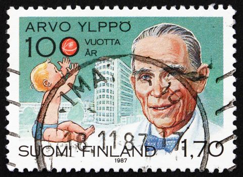 FINLAND - CIRCA 1987: a stamp printed in the Finland shows Arvo Yippo, Pediatrics Pioneer, Child and Lastenlinna Children�s Hospital, circa 1987