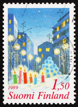 FINLAND - CIRCA 1981: a stamp printed in the Finland shows Candles in the Snow, Christmas, circa 1981