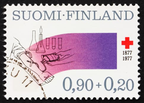 FINLAND - CIRCA 1977: a stamp printed in the Finland shows Blood Transfusion Service, Finnish Red Cross Centenary, circa 1977
