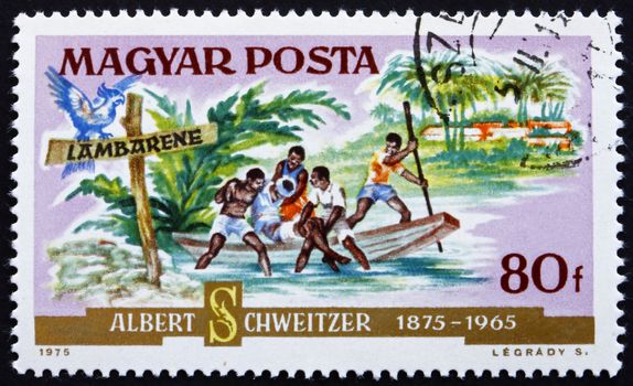 HUNGARY - CIRCA 1975: a stamp printed in the Hungary shows Patient Arriving by Boat, Dr. Albert Schweitzer, Medical Missionary and Musician, circa 1975
