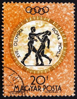 HUNGARY - CIRCA 1960: a stamp printed in the Hungary shows Boxers, Summer Olympic sports, Rome 60, circa 1960
