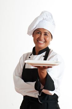 Smiling asian woman as restaurant chef with a plate in the hand