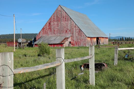 Old barn and fence in rural south Oregon Klamath Falls region.