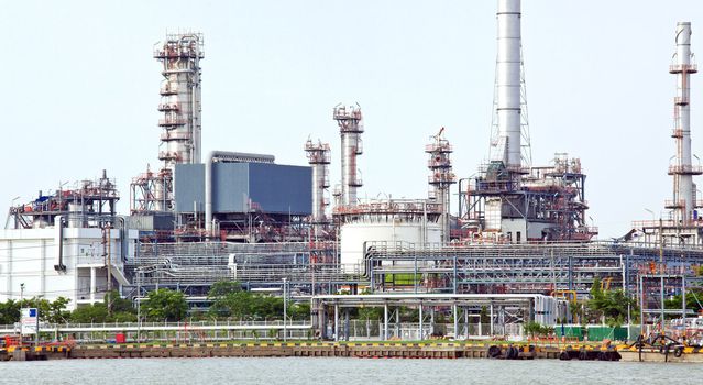 landscape of Oil refinery plant along river Panorama