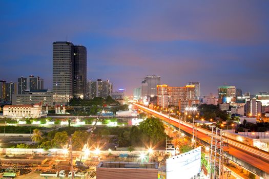 Aerial view of Bangkok Highway and building at downtown area at dusk