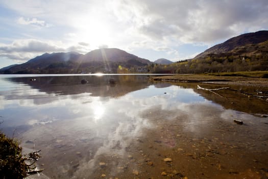 Sun Reflection of  Loch Shiel Lake at Glenn Finnan Highlands Scotland