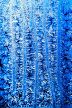 blue pattern of frost on the window