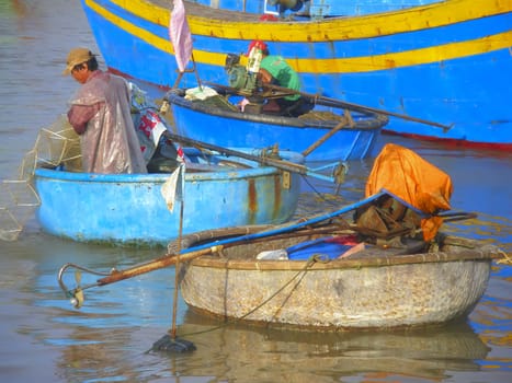 Vietnamese fisherman on the river near Phanthiet.