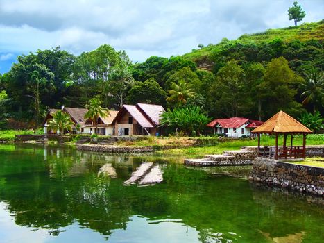 Lake Toba (Indonesian: Danau Toba) is a lake and supervolcano. The lake is 100 kilometres long and 30 kilometres wide, and 505 metres (1,666 ft) at its deepest point.                                     