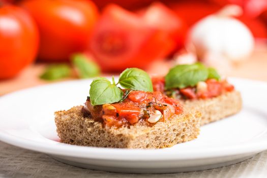 Crostini with tomato, garlic and basil. National italian dish