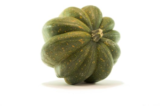 Studio close up of acorn squash isolated on white background with light shadow