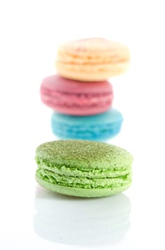 Close-up of colorful macaroons on light background