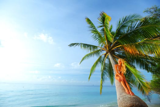 woman on palm sea on backgroud