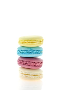 four  french macaroons  stack on  white background