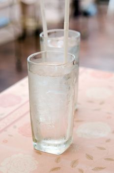 two glass of water with ice on table