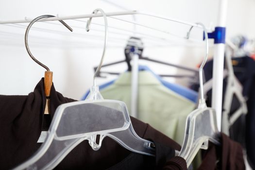 Close-up photo of the clothes and hangers in the dressing room