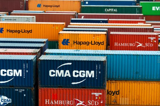 colorful freight containers at the docks of Hamburg harbor ready for shipping