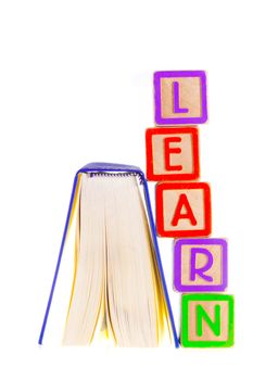 Learn Spelled Out Leaning on Open Book