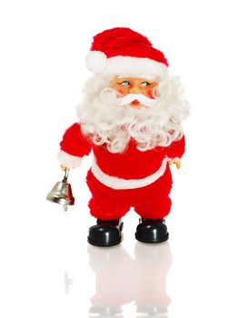 Santa Claus figurine holding bell, isolated on white