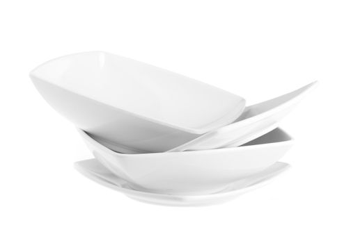 Stack of plain white dinner plates isolated on white background