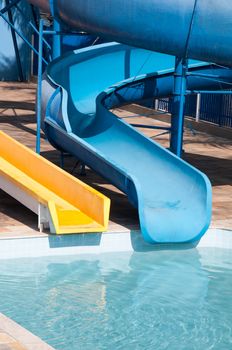 waterslide in waterpark and pool in tropical climate