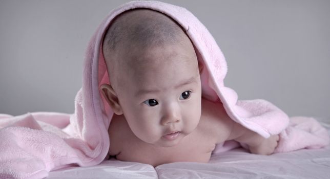 Baby after bath. Cheerful child.