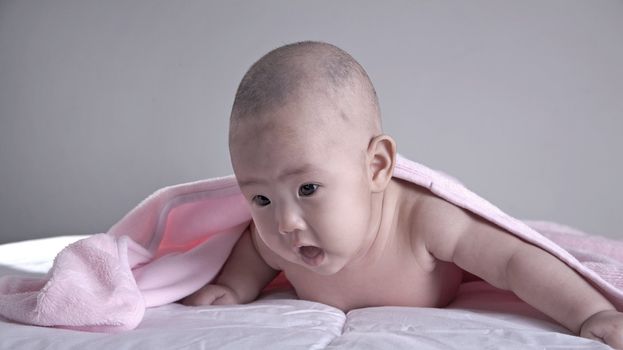 Baby after bath. Cheerful child.