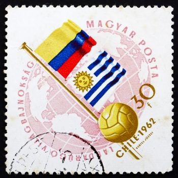 HUNGARY - CIRCA 1962: a stamp printed in the Hungary shows Globe, Ball and Flags of Argentina and Bulgaria, World Cup Soccer Championship, Chile, circa 1962