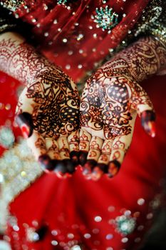 Beautiful henna tattoo in an Indian bride's hand