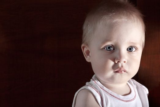 Portrait of a beautiful young boy on an abstract background.