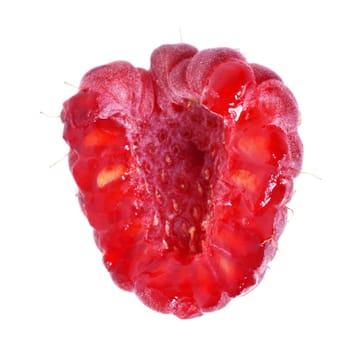 one half of ripe red raspberry on white background