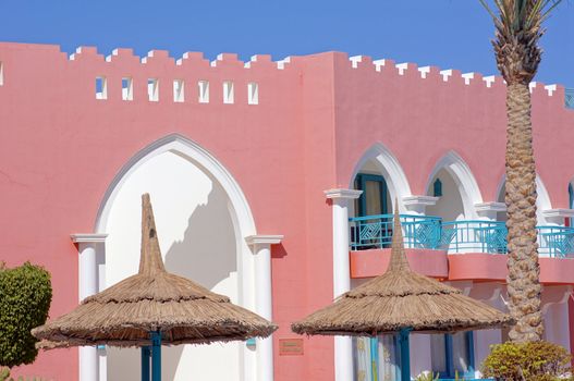 Arabic architecture: red walled building         