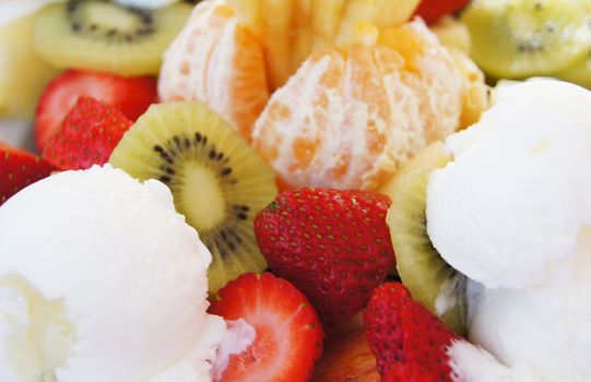desert with different tropic fruits and ice cream         