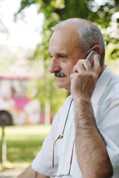 portrait of caucasian mature man with mobile phone