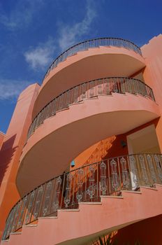 Arabic architecture: spiral staircase and blue sky              