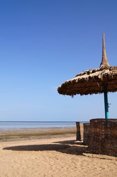 Sun umbrella on the sea beach                