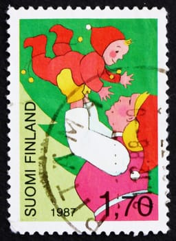 FINLAND - CIRCA 1987: a stamp printed in the Finland shows Mother and Child, Christmas Joy, circa 1987