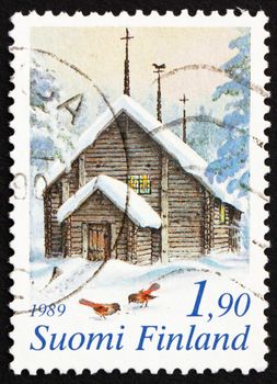 FINLAND - CIRCA 1989: a stamp printed in the Finland shows Sodankyla Church and Siberian Jays in Snow, Finland, Christmas, circa 1989