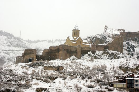 Tbilisi castle - Narikala, covered with snow, Georgia               