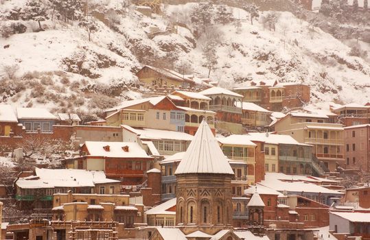 Winter view to covered with snow Tbilisi Old town in misty day