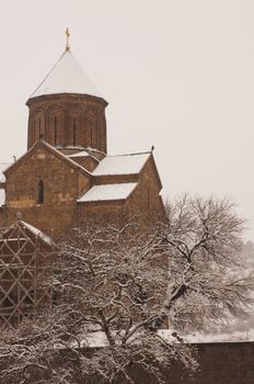 Winter view to covered with snow Tbilisi Old town in misty day