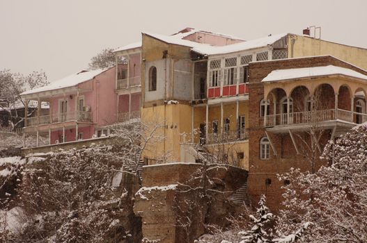 Winter view to covered with snow Tbilisi Old town in misty day