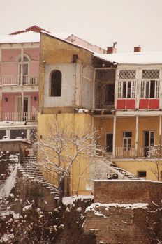 Winter view to covered with snow Tbilisi Old town in misty day