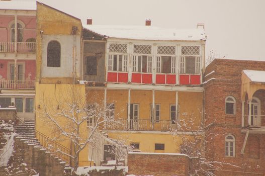 Winter view to covered with snow Tbilisi Old town in misty day